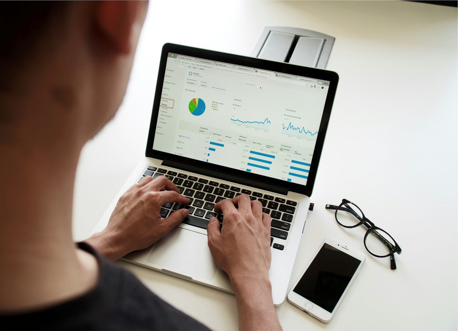 Person working on a laptop showing website analytics